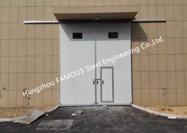 Grans obertures Portes de garatge industrials corredisses verticals Portes corredisses pesades motoritzades amb via d'acer